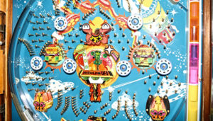 Part of the allure of a Pachinko machine is the artwork and graphic package. A flat, vinyl-like art layer forms the foundation of what you see on the machine. Dan Welch works with colleagues to replace and reconstruct this artwork on machines being restored.