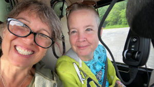 T.J. Dill, 53, a tattoo artist at White Tiger Tattoo in Rochester (left): “A lot of my clients in their 50s handle tattoos remarkably,” Dill says. On the right is Gretchen DeBerry, a friend.